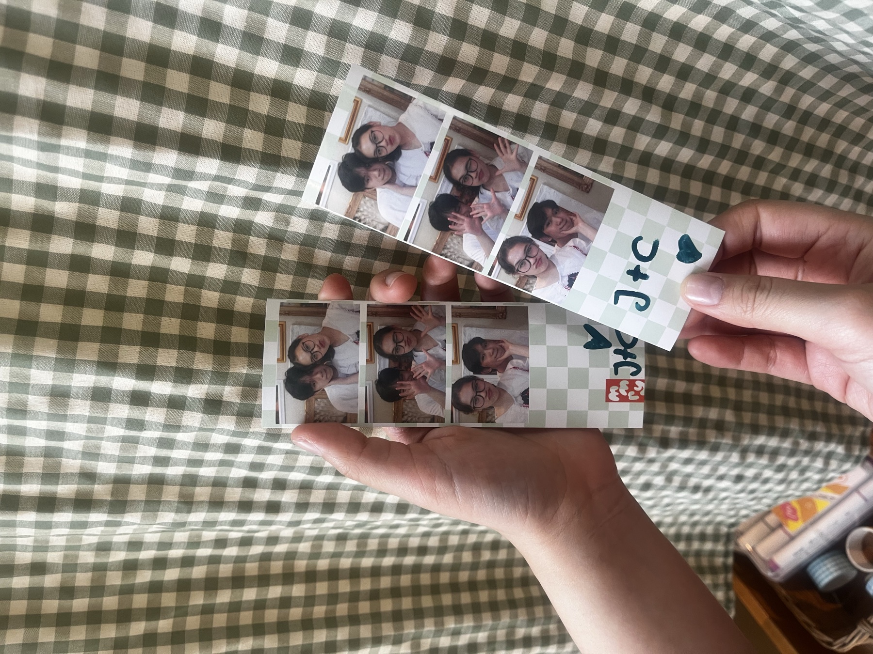 Holding our matching photobooth strips